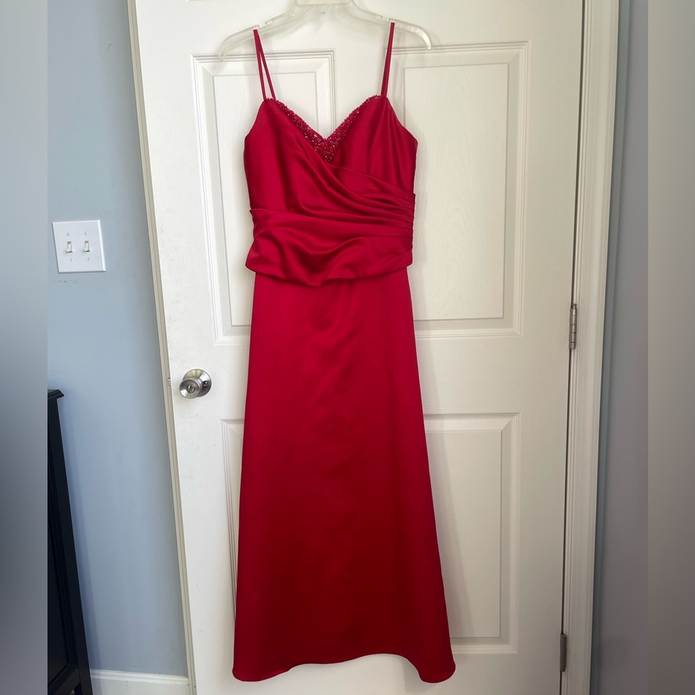 Beautiful full-length red formal dress with ruching and beading accent
